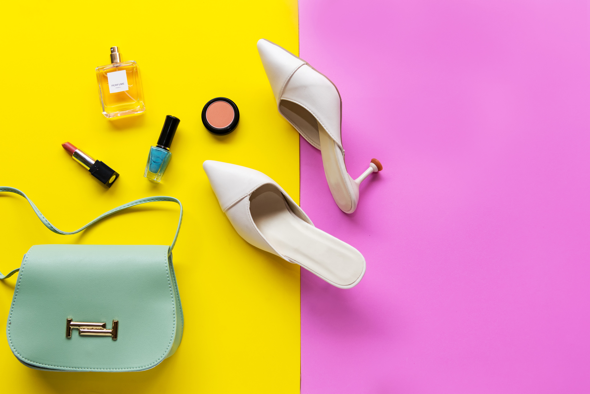 Fashion bag and shoe woman accessories pastel background.
